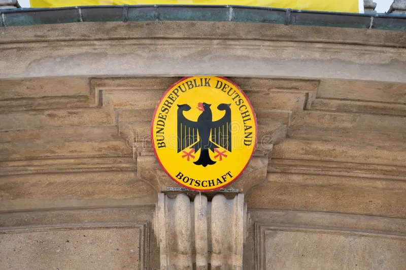 embassy-germany-sign-close-up-building-exterior-embassy-germany-sign-building-exterior-yellow-signage-401670479